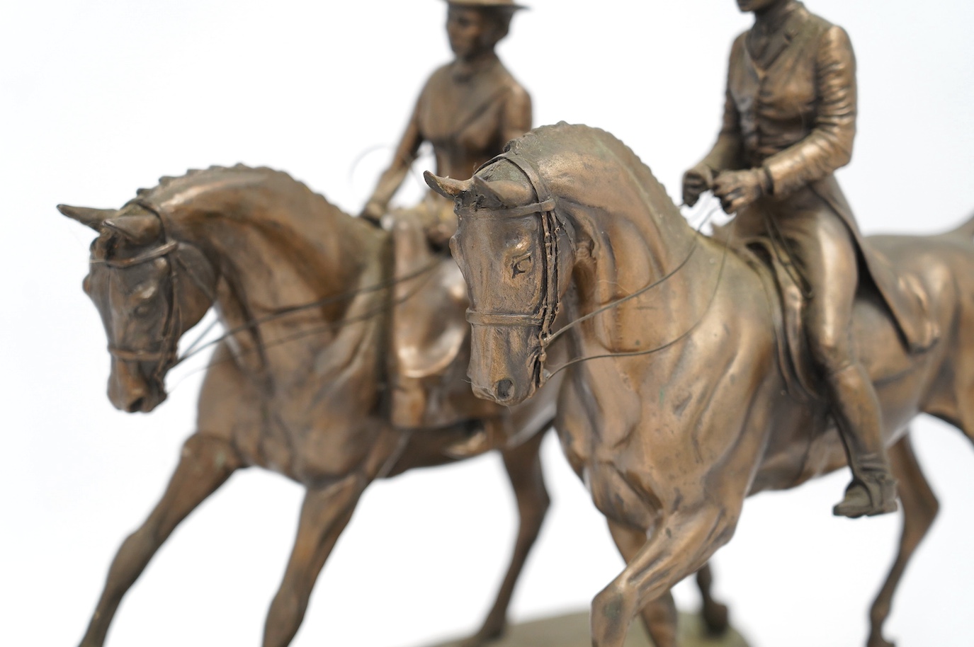 Harriet Glen and David Crenty, two cold cast resin bronze equestrian groups, 32cm wide. Condition - good
